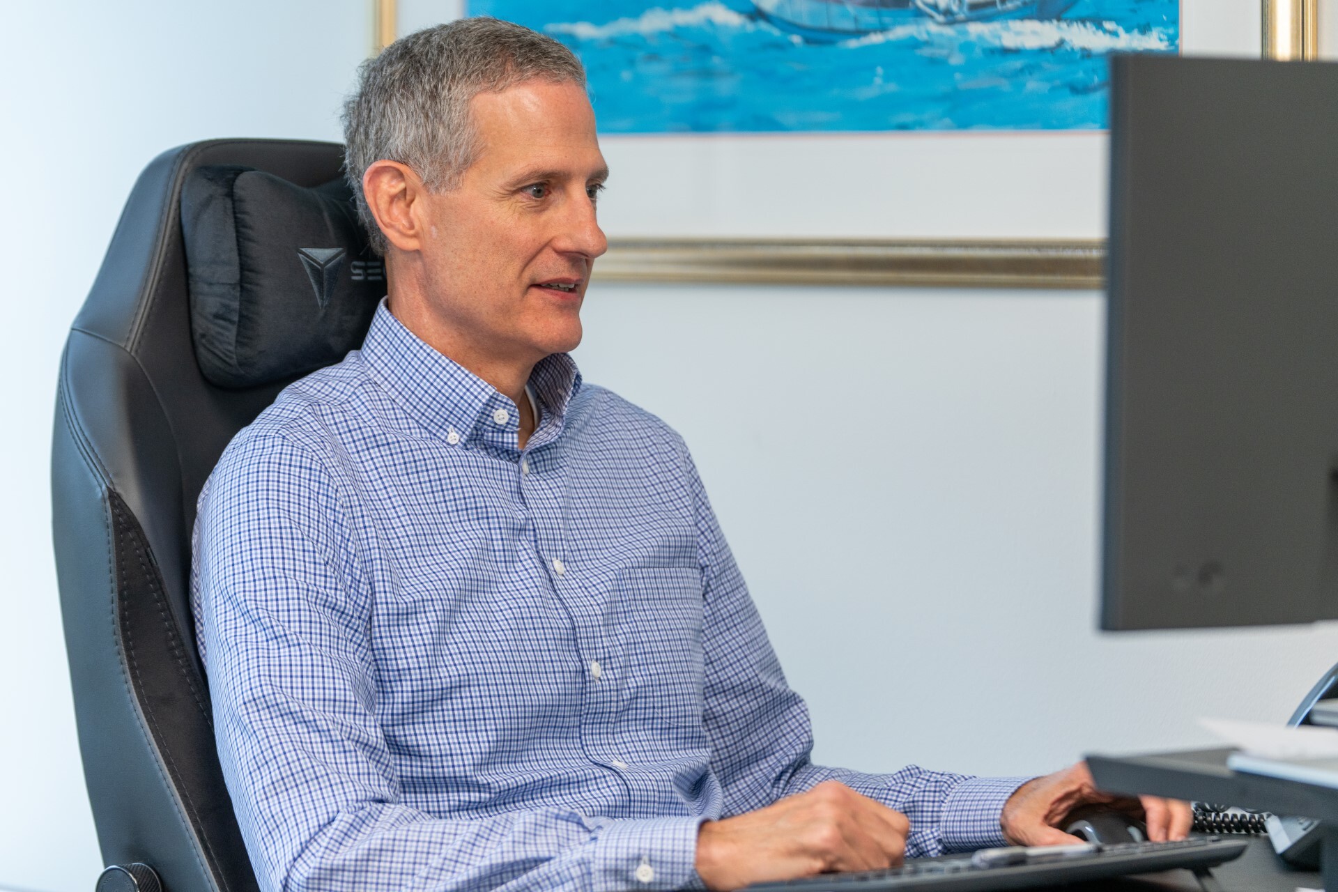 Advisor sitting in front of computer